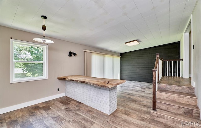 900 3rd St, Troy, MO 63379 - kitchen with wood finished floors, hanging light fixtures, and wooden walls