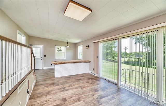 900 3rd St, Troy, MO 63379 - kitchen featuring wood finished floors and a peninsula