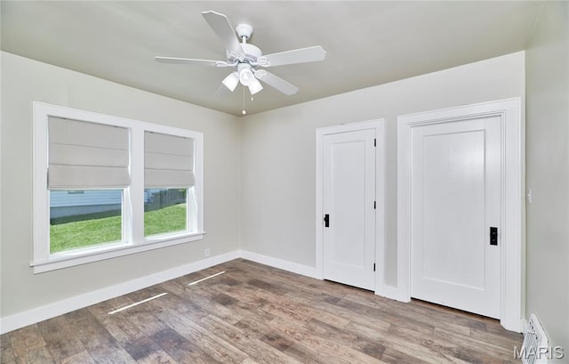 900 3rd St, Troy, MO 63379 - unfurnished bedroom featuring wood finished floors and a ceiling fan