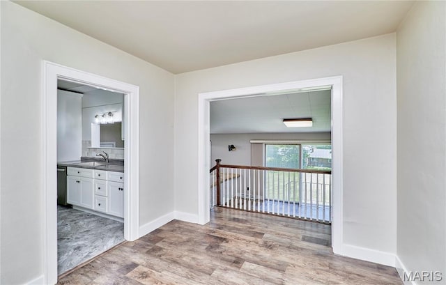 900 3rd St, Troy, MO 63379 - hallway with light wood-style floors and baseboards