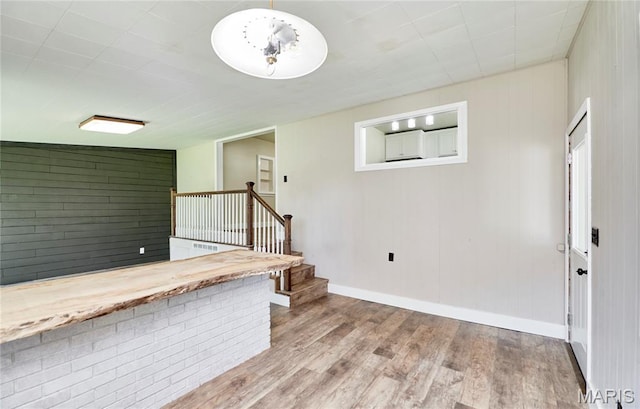 900 3rd St, Troy, MO 63379 - unfurnished living room with wood finished floors and stairway