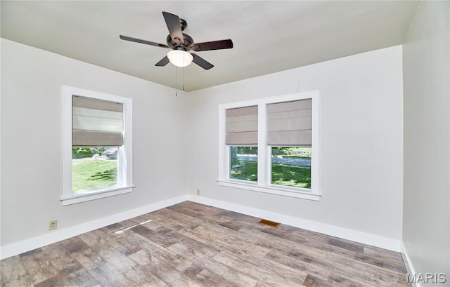 900 3rd St, Troy, MO 63379 - empty room with wood finished floors and a ceiling fan