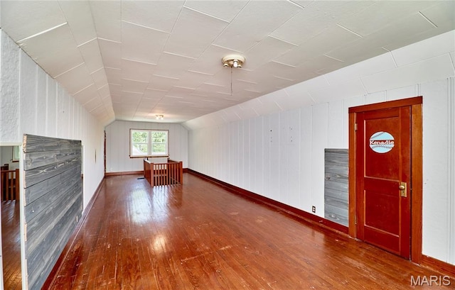 900 3rd St, Troy, MO 63379 - additional living space featuring wood-type flooring, lofted ceiling, and wood walls