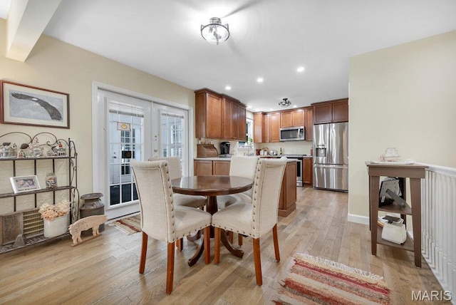 7 Mcclay Village Cir, Saint Peters, MO 63376 - dining space with light wood finished floors, french doors, and recessed lighting