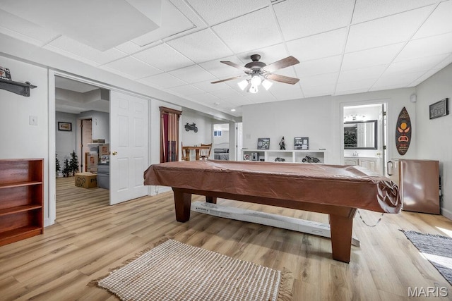 7 Mcclay Village Cir, Saint Peters, MO 63376 - playroom with billiards, a ceiling fan, light wood-style floors, and a paneled ceiling
