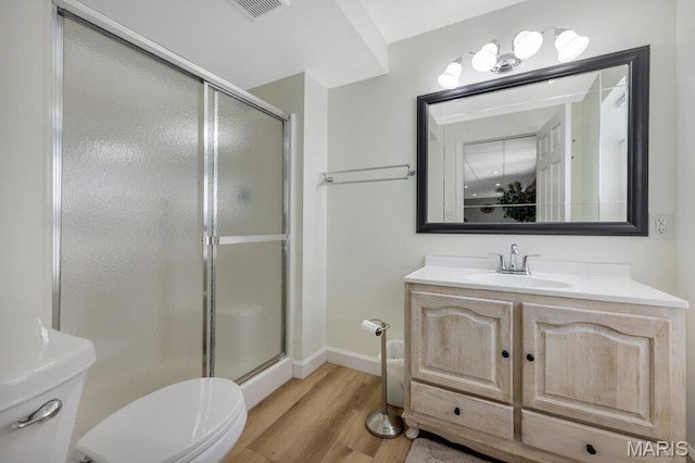 7 Mcclay Village Cir, Saint Peters, MO 63376 - bathroom featuring a shower stall, vanity, and wood finished floors