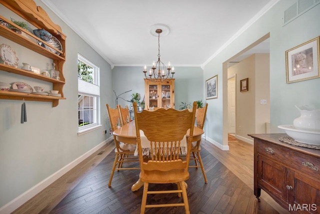 7 Mcclay Village Cir, Saint Peters, MO 63376 - dining room with a chandelier, dark wood-style flooring, and ornamental molding
