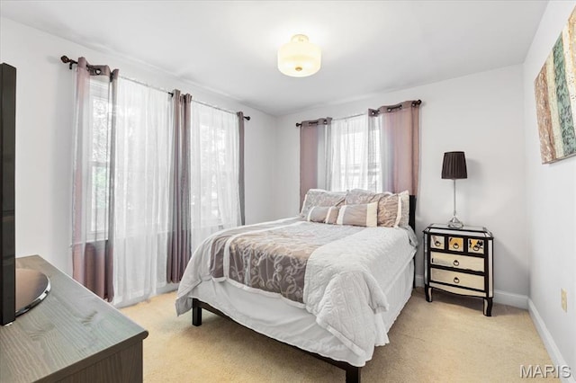7248 Dorset Ave, University City, MO 63130 - bedroom featuring multiple windows and light colored carpet