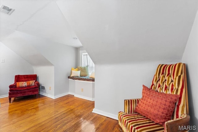 7248 Dorset Ave, University City, MO 63130 - living area featuring wood finished floors and lofted ceiling