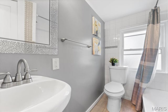 7248 Dorset Ave, University City, MO 63130 - bathroom with tile patterned floors, tile walls, and shower / tub combo