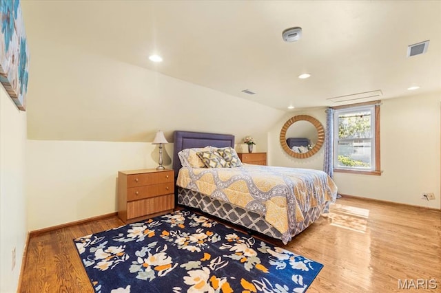 7248 Dorset Ave, University City, MO 63130 - bedroom featuring wood finished floors, vaulted ceiling, and recessed lighting