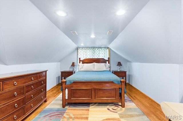 7248 Dorset Ave, University City, MO 63130 - bedroom with light wood finished floors, vaulted ceiling, and recessed lighting
