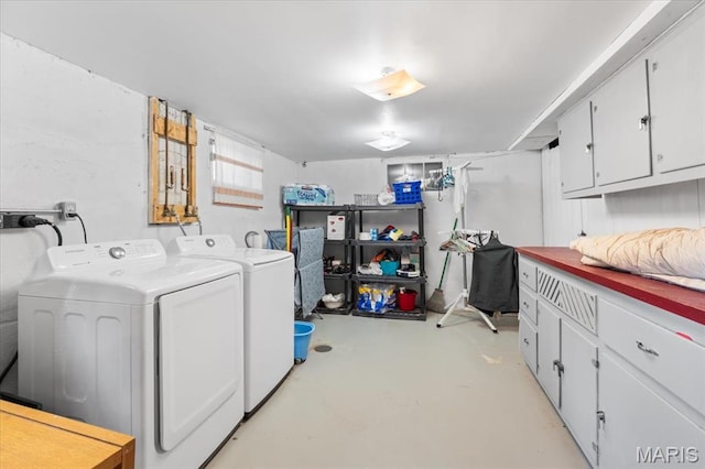 7248 Dorset Ave, University City, MO 63130 - washroom with washer and clothes dryer and cabinet space