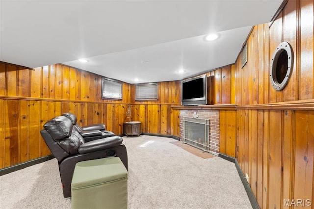 7248 Dorset Ave, University City, MO 63130 - carpeted living room with a fireplace, wood walls, and recessed lighting