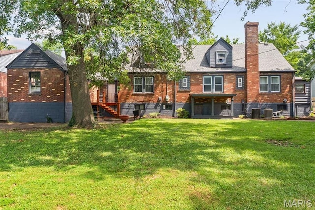 7248 Dorset Ave, University City, MO 63130 - back of property featuring a chimney, brick siding, a yard, and stairway