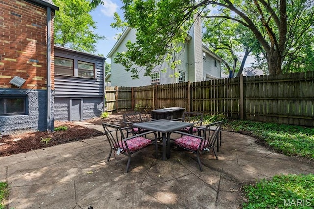 7248 Dorset Ave, University City, MO 63130 - fenced backyard with outdoor dining area and a patio area