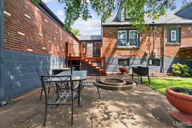 7248 Dorset Ave, University City, MO 63130 - view of patio with a fire pit, stairs, and a deck