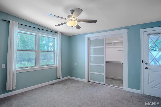 6557 Marmaduke Ave, Saint Louis, MO 63139 - unfurnished bedroom with carpet, a closet, and a ceiling fan