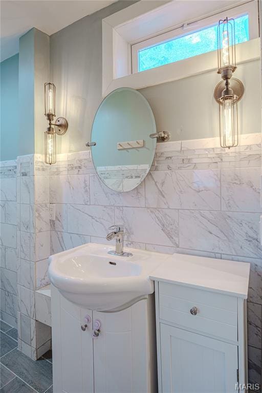 6557 Marmaduke Ave, Saint Louis, MO 63139 - bathroom with tile walls, vanity, and wainscoting
