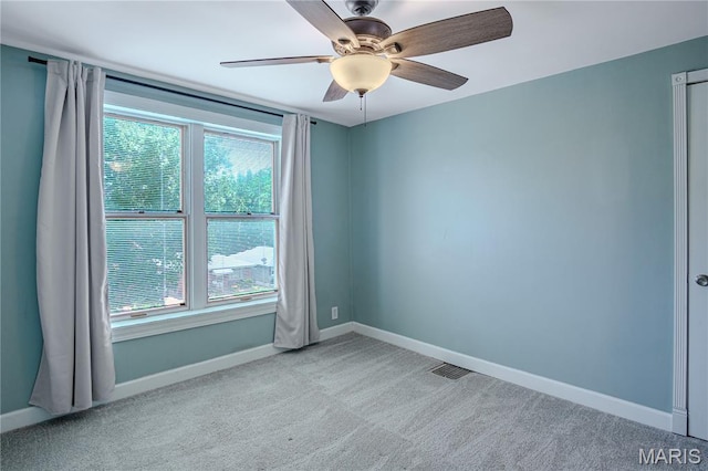 6557 Marmaduke Ave, Saint Louis, MO 63139 - empty room with carpet flooring and a ceiling fan