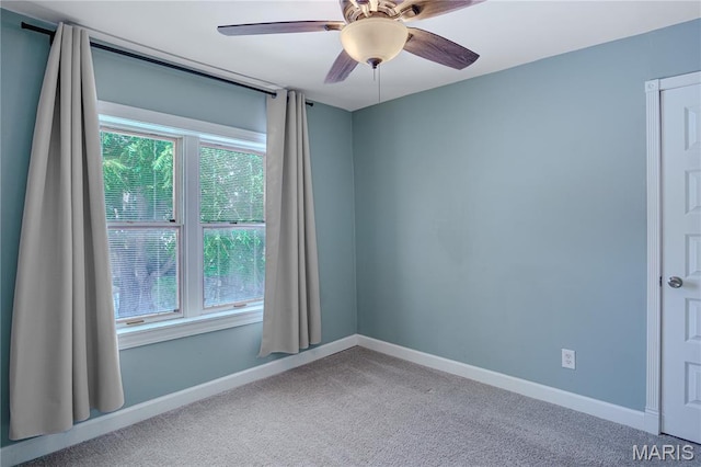 6557 Marmaduke Ave, Saint Louis, MO 63139 - carpeted empty room with baseboards and a ceiling fan