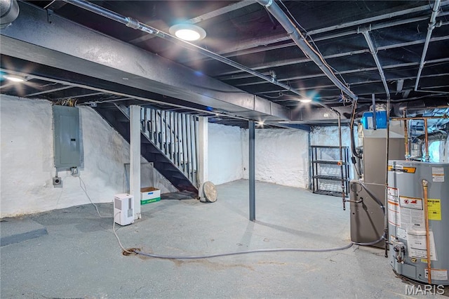 6557 Marmaduke Ave, Saint Louis, MO 63139 - unfinished basement featuring gas water heater, electric panel, stairs, and heating unit