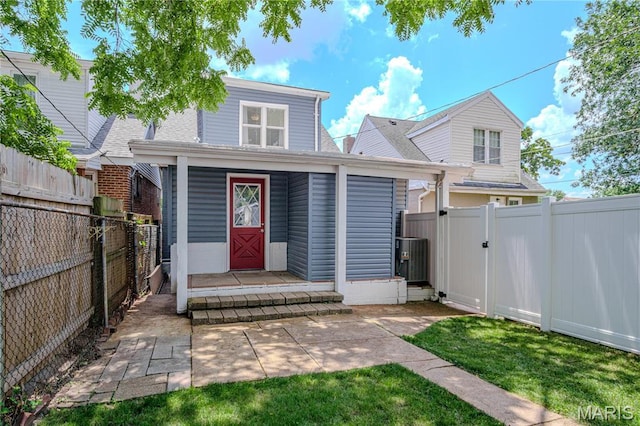 6557 Marmaduke Ave, Saint Louis, MO 63139 - view of front of house with a fenced backyard, a gate, and roof with shingles