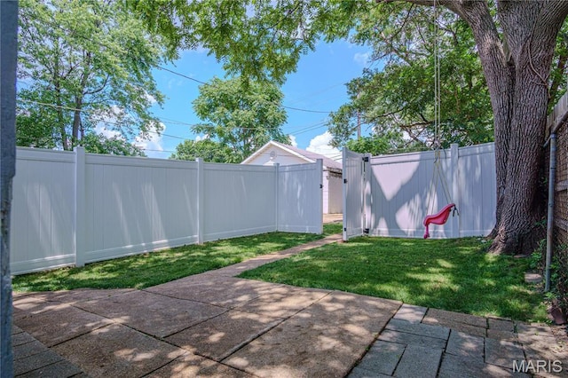 6557 Marmaduke Ave, Saint Louis, MO 63139 - fenced backyard with a patio