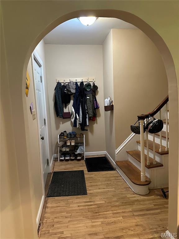325 N Prairie St, Greenville, IL 62246 - mudroom featuring arched walkways and wood finished floors