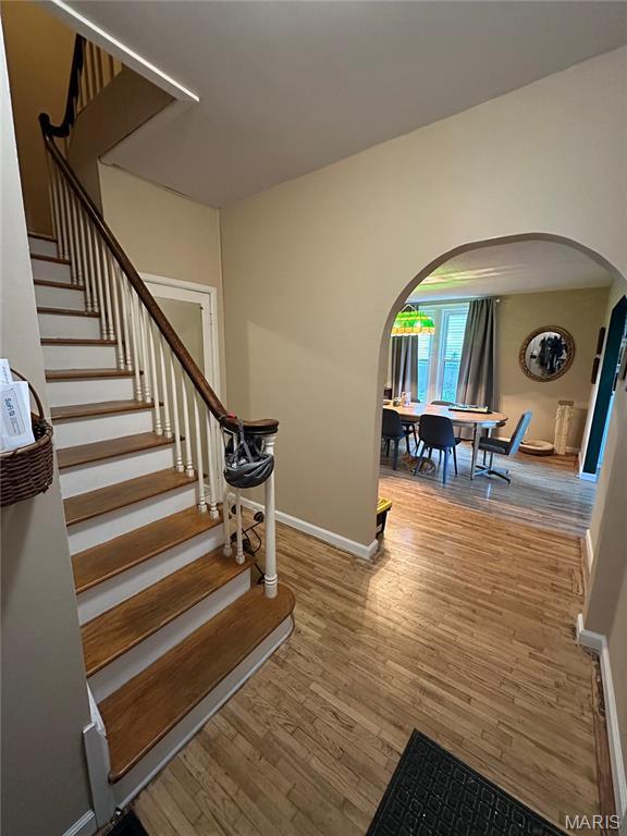 325 N Prairie St, Greenville, IL 62246 - stairs with arched walkways and wood finished floors