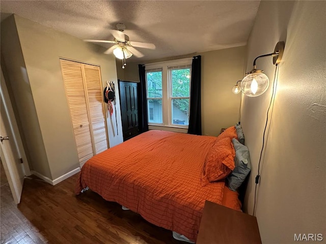 325 N Prairie St, Greenville, IL 62246 - bedroom featuring wood finished floors, a closet, a ceiling fan, and a textured ceiling