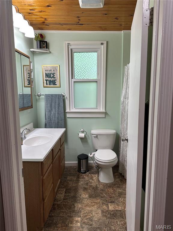 325 N Prairie St, Greenville, IL 62246 - full bathroom with wood ceiling, vanity, and stone finish floors