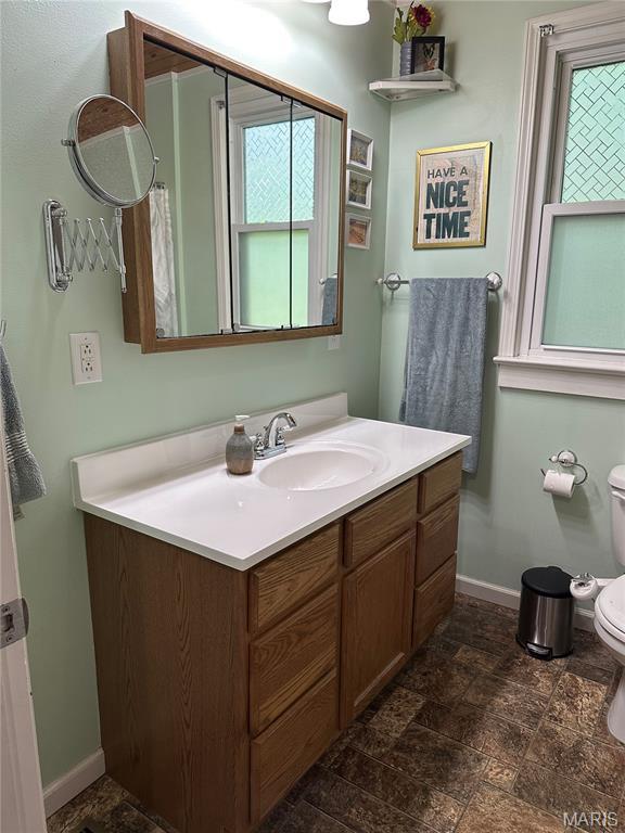 325 N Prairie St, Greenville, IL 62246 - bathroom featuring vanity and stone finish floors