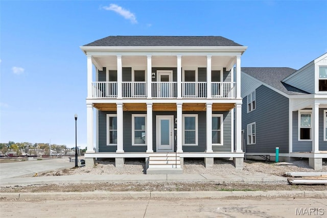 2921 Memphis St, Saint Charles, MO 63301 - greek revival house featuring a balcony and covered porch