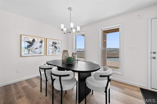 2921 Memphis St, Saint Charles, MO 63301 - dining area featuring light wood-style flooring and a chandelier