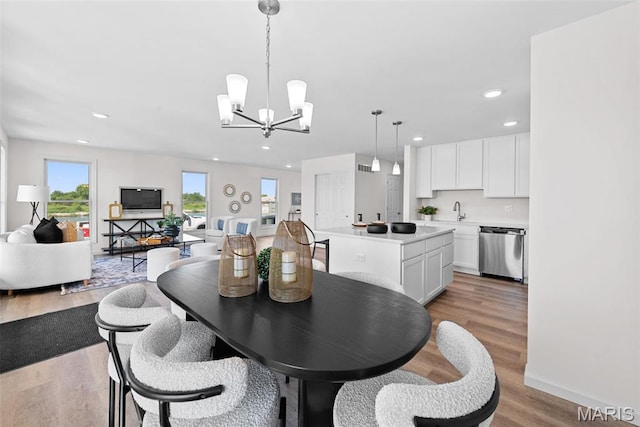 2921 Memphis St, Saint Charles, MO 63301 - dining space featuring a chandelier, light wood-type flooring, and recessed lighting