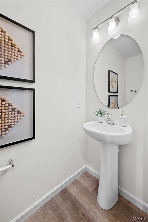 2921 Memphis St, Saint Charles, MO 63301 - bathroom with wood finished floors and baseboards