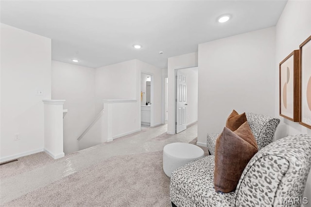 2921 Memphis St, Saint Charles, MO 63301 - sitting room featuring an upstairs landing, carpet, and recessed lighting