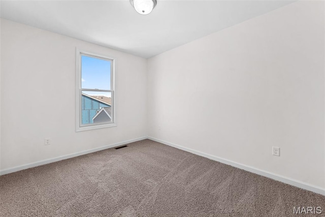 2921 Memphis St, Saint Charles, MO 63301 - carpeted empty room featuring baseboards
