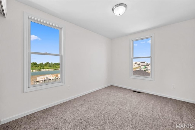 2921 Memphis St, Saint Charles, MO 63301 - empty room with carpet floors and baseboards