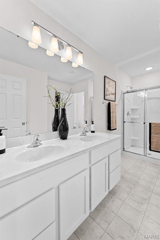 2921 Memphis St, Saint Charles, MO 63301 - full bath with double vanity, a stall shower, and tile patterned flooring