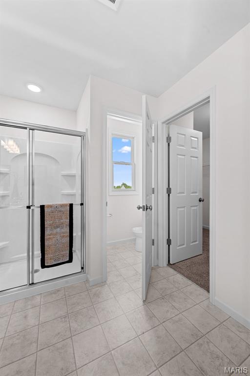 2921 Memphis St, Saint Charles, MO 63301 - full bath with a stall shower and tile patterned flooring