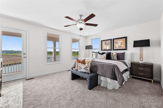 2921 Memphis St, Saint Charles, MO 63301 - bedroom featuring access to exterior, carpet, a water view, and a ceiling fan