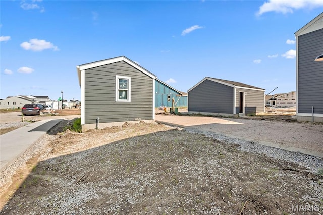 2921 Memphis St, Saint Charles, MO 63301 - back of property with a residential view and an outbuilding