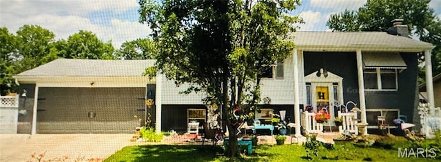 1918 Lone Pine Dr, Arnold, MO 63010 - bi-level home with a chimney and an attached garage