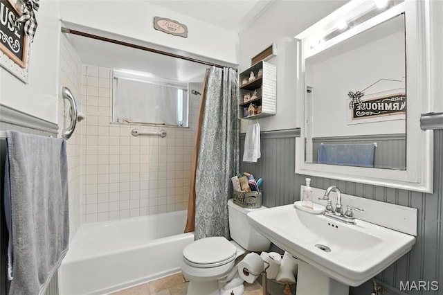 1918 Lone Pine Dr, Arnold, MO 63010 - full bathroom featuring shower / bath combo with shower curtain, wainscoting, and tile patterned floors