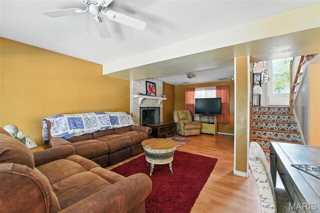 1918 Lone Pine Dr, Arnold, MO 63010 - living area with light wood finished floors, stairway, a brick fireplace, and ceiling fan