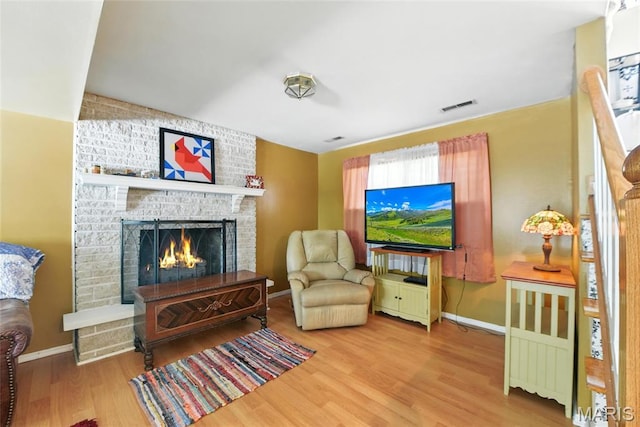 1918 Lone Pine Dr, Arnold, MO 63010 - living area with a fireplace and wood finished floors