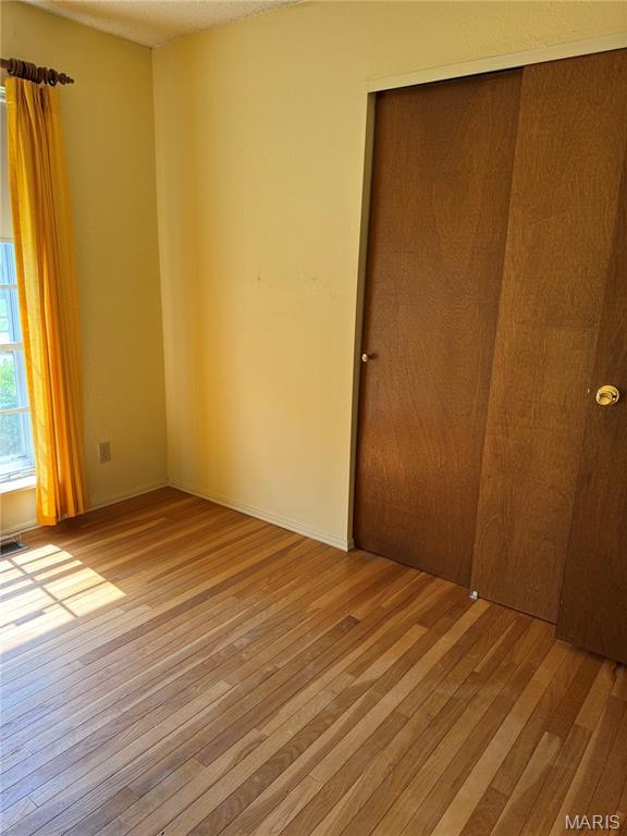 11646 Esperanza Dr, Florissant, MO 63033 - unfurnished room featuring light wood-style flooring