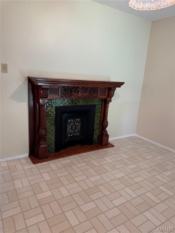 11646 Esperanza Dr, Florissant, MO 63033 - detailed view of baseboards and a tile fireplace